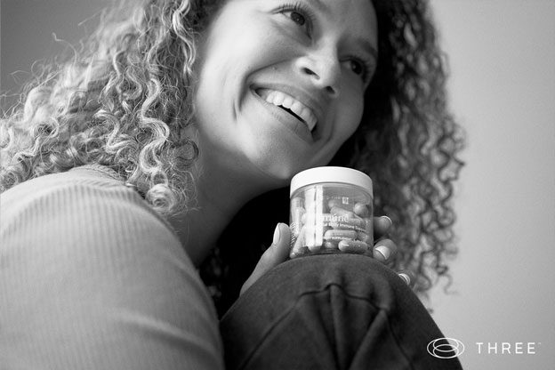 three brand ambassador holding three supplement